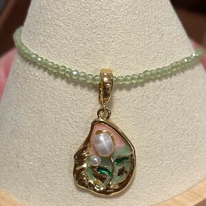 Freshwater pearl pendant with flower design and peridot necklace